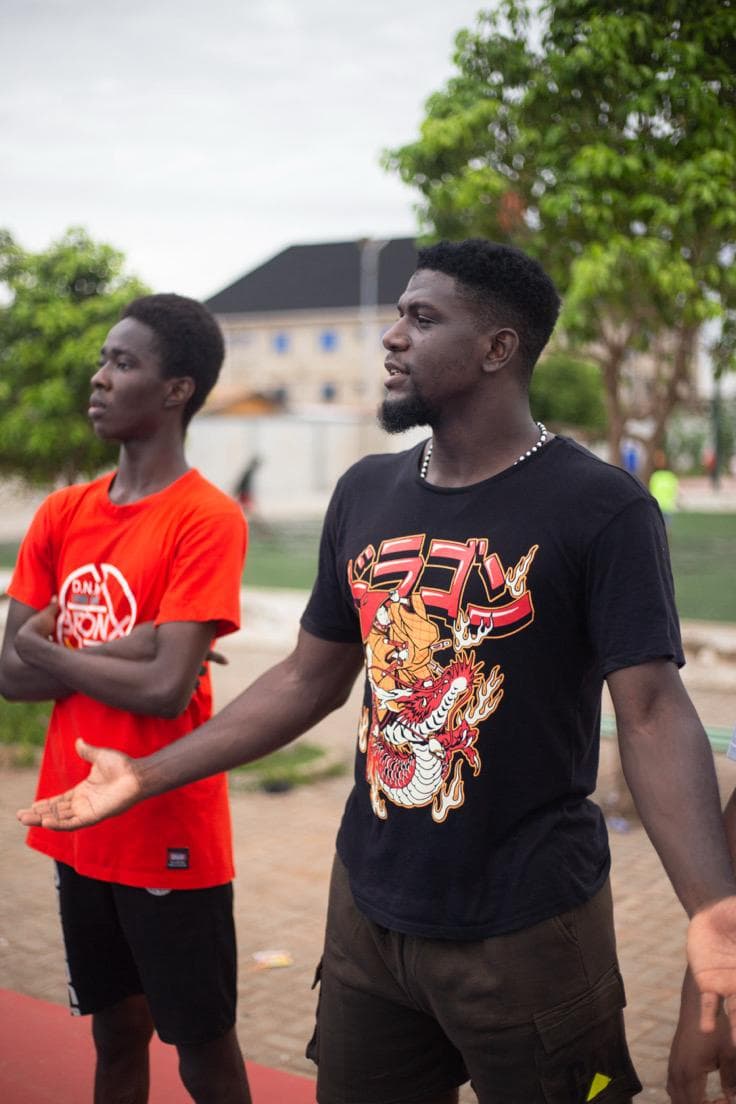 Fans courtside at Madina Basketball